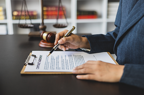 Notary signing a legal document